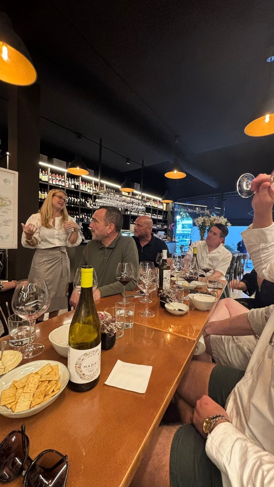 A larger private wine tasting group at a Sitges wine shop